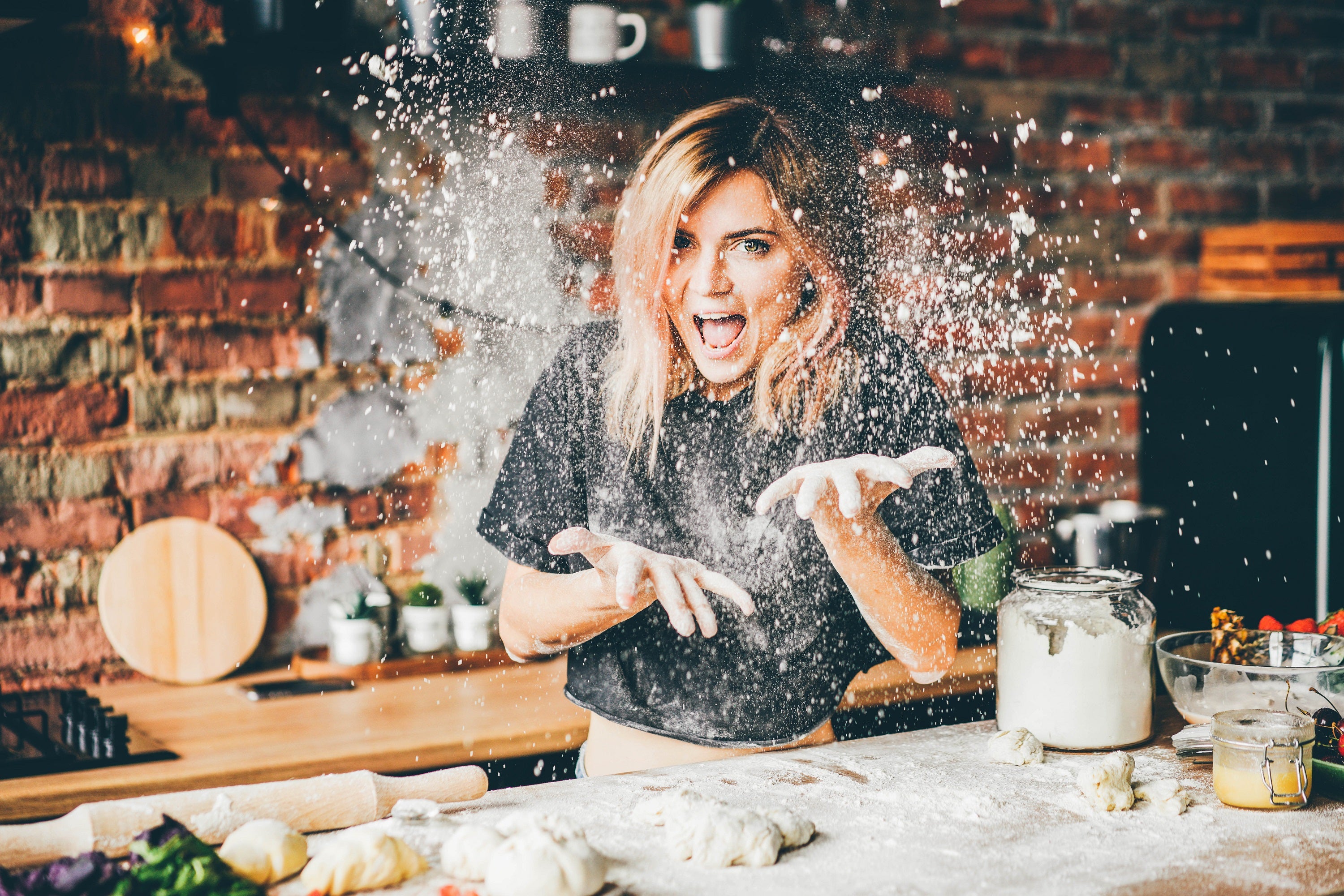 happy woman in kitchen handyntrendy